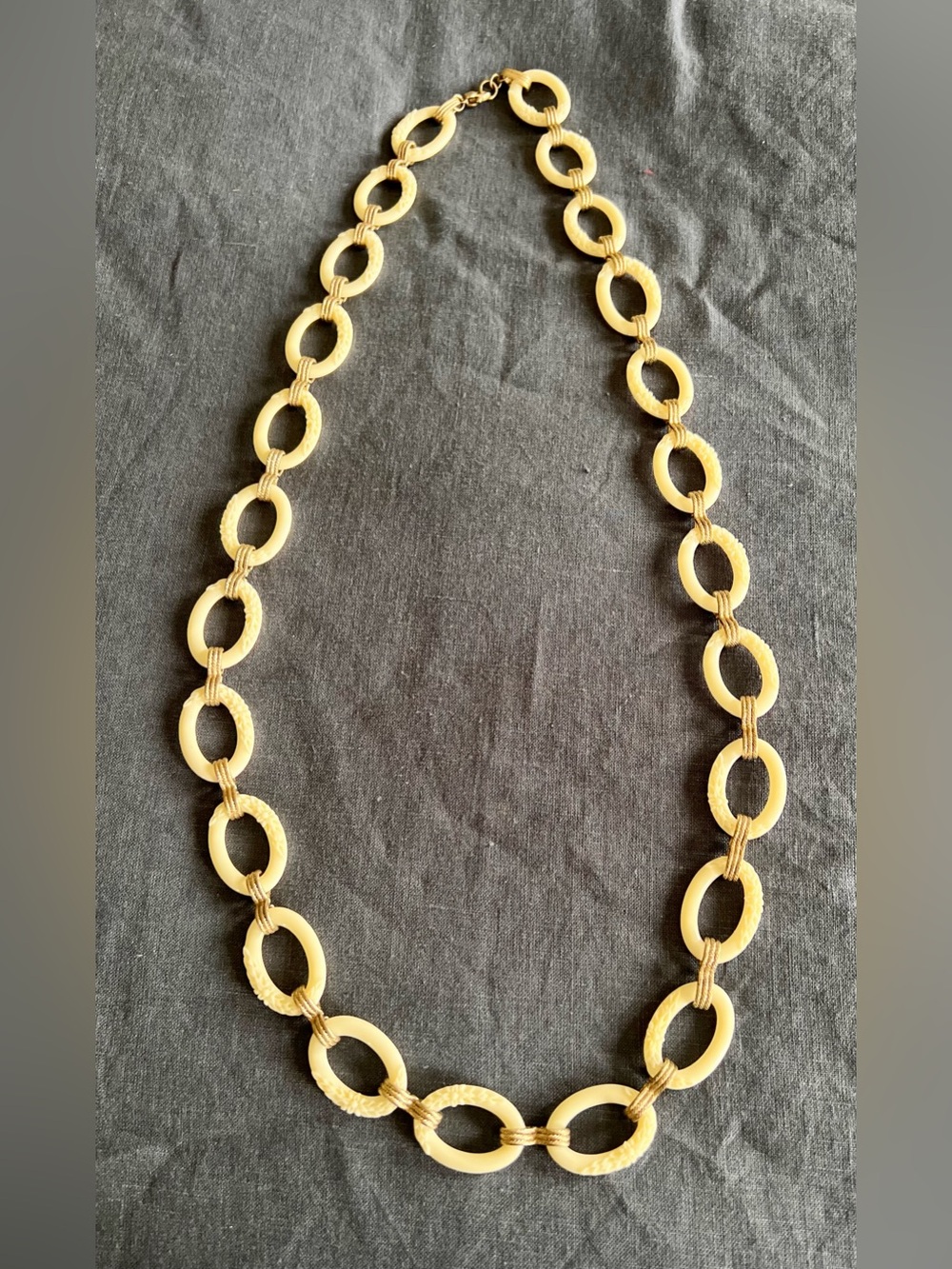 Vintage Monet faux carved ivory chain with gold tone links